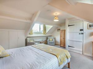 a bedroom with a large bed in a room at 3 Bed in Chapel Stile SZ161 in Chapel Stile