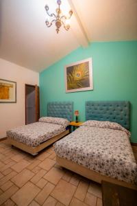 En eller flere senge i et værelse på Hotel Casa ixtapan