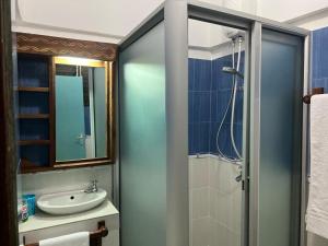 a bathroom with a sink and a shower at Mama Africa Village Villas in Mtwapa +70 photos
