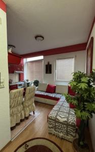 a living room with a couch and two chairs at Ohrid in Ohrid