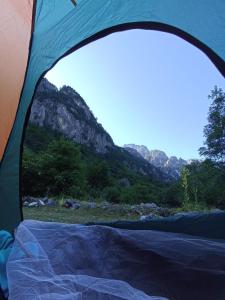 a tent with a view of a mountain at North wild camping in Shkodër