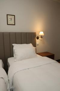 Ein Bett oder Betten in einem Zimmer der Unterkunft Hotel Ribadouro