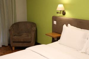 Ein Bett oder Betten in einem Zimmer der Unterkunft Hotel Ribadouro