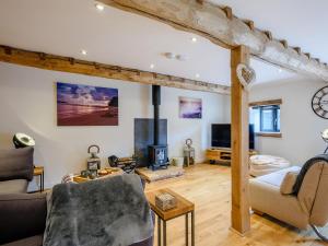 a living room with a couch and a fireplace at 3 bed in Winterton-on-Sea 77582 in Hickling