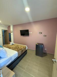 Postel nebo postele na pokoji v ubytování Davé Paradise