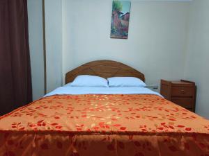 A bed or beds in a room at Hospedaje Qoricha'skas