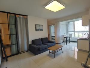 a living room with a couch and a table at egolife in Beijing