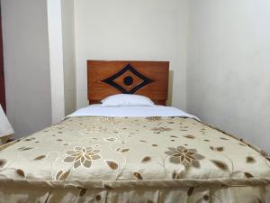 A bed or beds in a room at Hospedaje Qoricha'skas