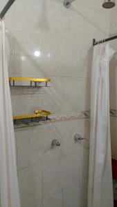 a bathroom with a shower with a shower curtain at Casa Vacacional La Arcada in Oaxaca City +48 photos