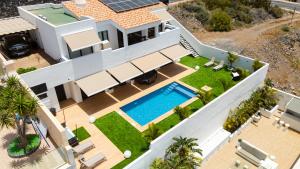 an aerial view of a house with a swimming pool at Saras Village in Adeje