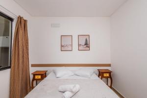 Ένα ή περισσότερα κρεβάτια σε δωμάτιο στο 700m da praia | Piçarras | 20min Beto Carrero