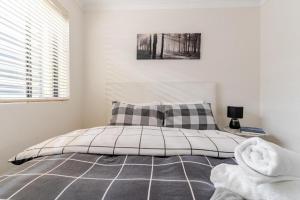 Ένα ή περισσότερα κρεβάτια σε δωμάτιο στο City View Serviced Apartments