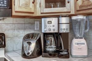 a kitchen counter with a coffee maker and a blender at Atrium Unit #108 Condo in Breckenridge