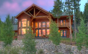 a large wooden house in the woods at Timber Heights Lodge in Breckenridge