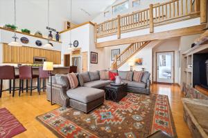 a living room with a couch and a table at Timber Heights Lodge in Breckenridge
