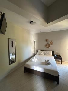 a bedroom with a large bed in a room at Casa de Kalika in Chania