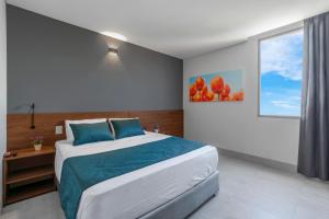 Postel nebo postele na pokoji v ubytování HOTEL RILUX Barrancabermeja