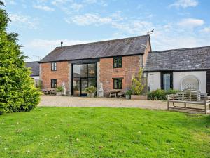a brick house with a bench in front of it at 3 Bed in Shaftesbury 95685 in Sedghill