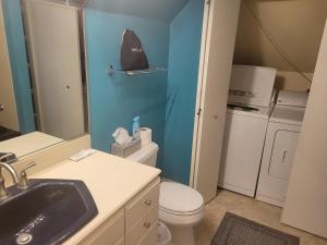 a small bathroom with a toilet and a sink at The Weis Mansion Bed and Breakfast in Waterloo +51 photos