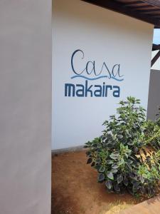 a sign for ama maliki on the side of a building at Casa Makaira in Fernando de Noronha