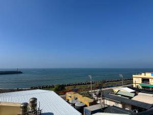 a view of a harbor with the ocean in the background at 漾漾漫旅Young B&B in Fangliao +14 photos