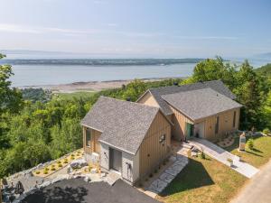 an overhead view of two houses on a hill at La Bergerie in Saint-Joseph-de-la-Rive