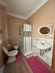 a bathroom with a toilet a sink and a shower at Arya in Montesilvano