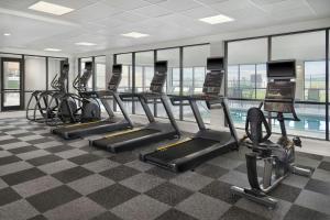a gym with treadmills and elliptical machines at TownePlace Suites by Marriott Columbus in Columbus