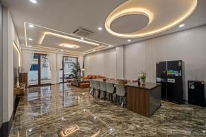 a lobby with a bar and a living room at T P Villa in Da Nang