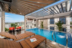 a swimming pool on the balcony of a building at T P Villa in Danang