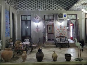 Гостиная зона в Hotel Gulnaraxanum Boutique This hotel is nearby the center of the old city Every room decorated in the unique style