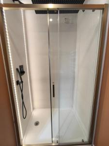 a shower with a glass door in a bathroom at La fin de journée-T3-Wifi-parking in Saint-Yrieix-sur-Charente