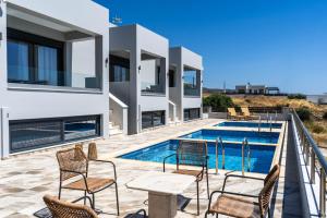 a view of a villa with a swimming pool at Kalon Gaia NOSTOS in Karistos