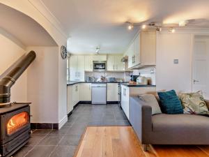 a living room with a couch and a stove at 3 Bed in Faceby 95424 in Whorlton