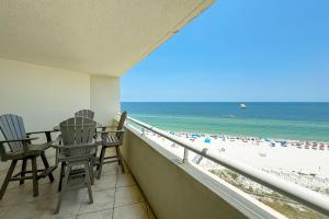 a balcony with chairs and a view of the beach at Perdido Sun Unit 914 in Pensacola