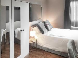 a bedroom with a bed with two pillows on it at The Inn And Around in Kenton