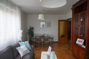 a living room with a couch and a table at Apartamento Ermitagaña in Pamplona