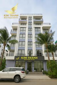 a car parked in front of a hotel at Flamingo Ibiza Hải Tiến - Kim Thành Boutique Hotel in Gò Ba Quần