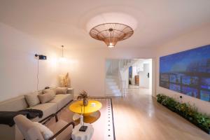 a living room with a couch and a table at Book and Bed-Yuyuan 2 in Shanghai