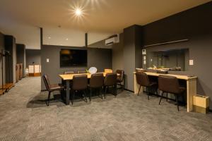 a dining room with a large table and chairs at 廣島別邸 デラックススイート Hiroshima Villa for 10ppl - Supported by COCOSTAY in Hiroshima