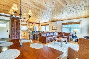 a living room with a couch and a table at Stowe Sticks in Stowe +16 photos