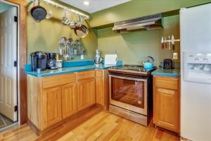a kitchen with wooden cabinets and blue counter tops at Mountain Haus in Stowe Fork