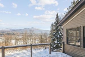 a balcony with a view of the mountains at Pinnacle Lookout in Stowe