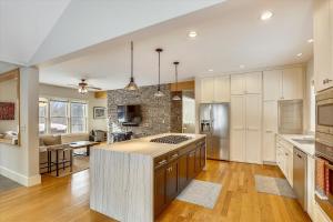 a kitchen with a island in the middle of a room at The Eagle's Nest at Stowe in Stowe