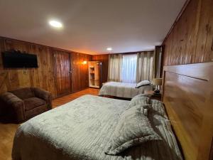 Postelja oz. postelje v sobi nastanitve Hostal Chumay