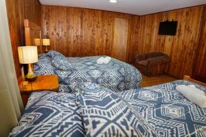 Postelja oz. postelje v sobi nastanitve Hostal Chumay