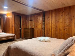 Postelja oz. postelje v sobi nastanitve Hostal Chumay