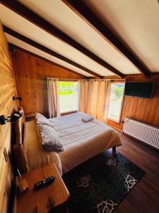 Postelja oz. postelje v sobi nastanitve Hostal Chumay