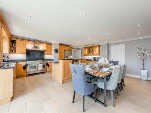 a kitchen and dining room with a table and chairs at Marine Villa in Goring by Sea