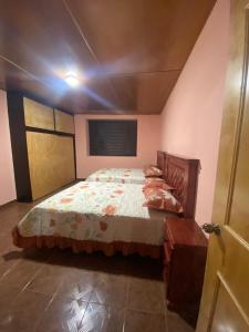 a bedroom with a large bed in a room at Posada Santa Rita in Zacatlán